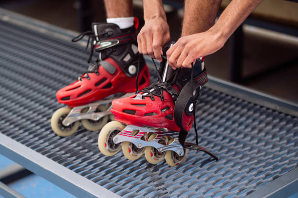 Sportsman. Close up picture of man tying rollers before the ride
