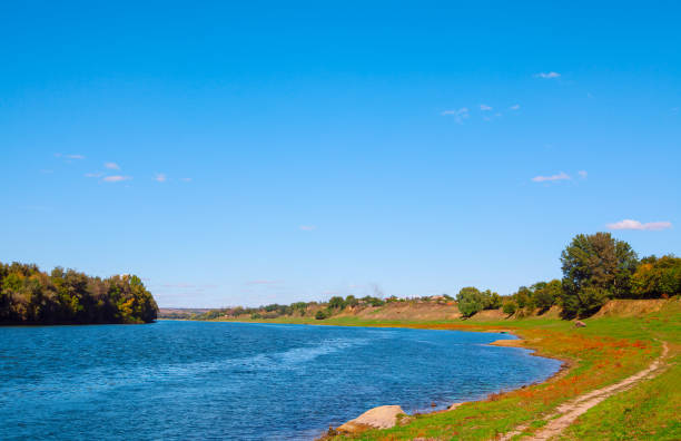 istock River with village and a green forest in the background 2167192918