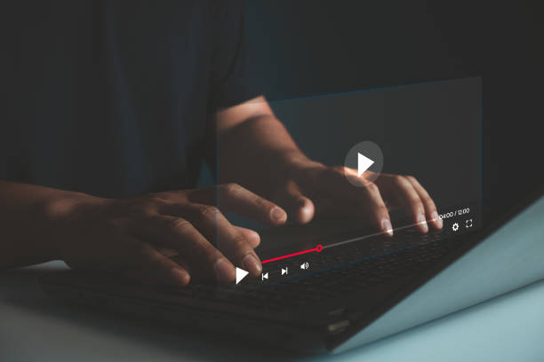 istock Video streaming on internet. Man hands using laptop computer for streaming and watching online movie, TV series, live concert, show or tutorial. Concept about subscription based live digital stream. 2167192990
