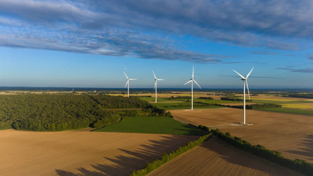 istock Wind Turbines in a Vast Agricultural Landscape Under a Clear Sky 2167193051