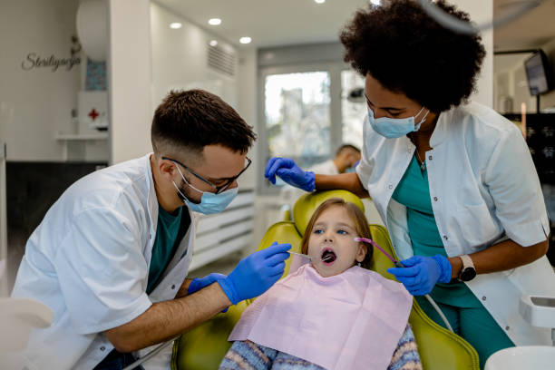 istock Child's dental exam by expert team 2167193696