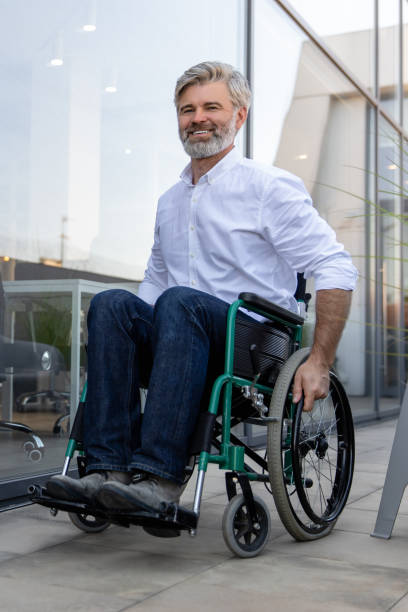 istock Mature man on a wheelchair looking determined and confident 2167194121