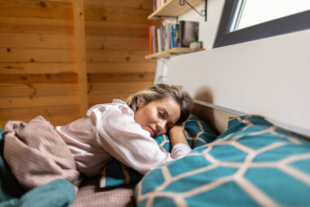 istock Beautiful woman sleeping in a mountain cottage 2167196121