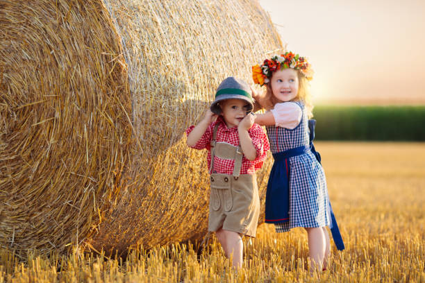istock Child in wheat field with German bread 2167198857