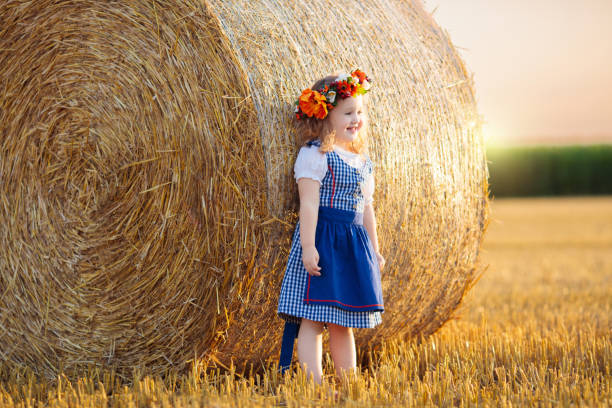 istock Child in wheat field with German bread 2167199738