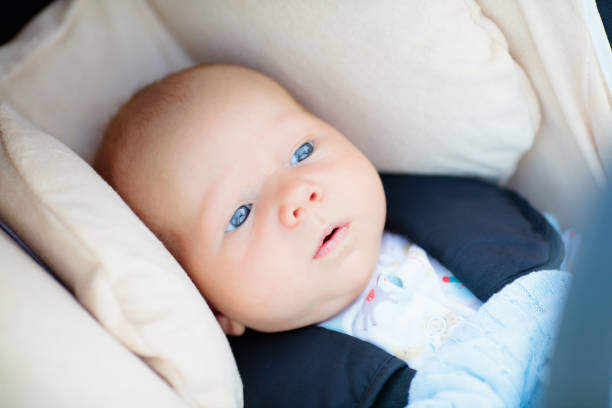 istock Newborn baby in car seat 2167199820