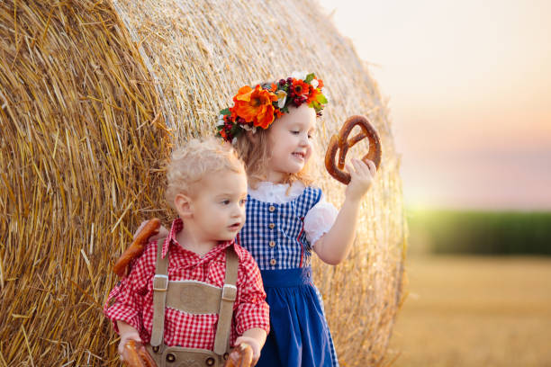 istock Child in wheat field with German bread 2167200091