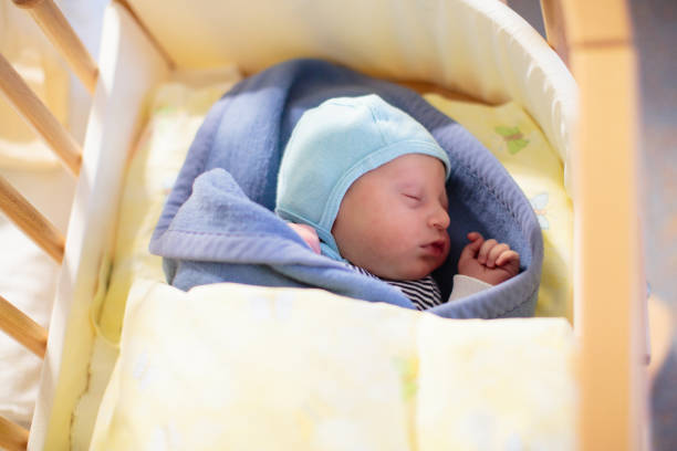 istock Newborn baby boy in hospital cot 2167200132