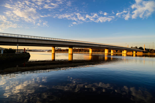 istock Low angle view of bridge over river against sky 2167200325