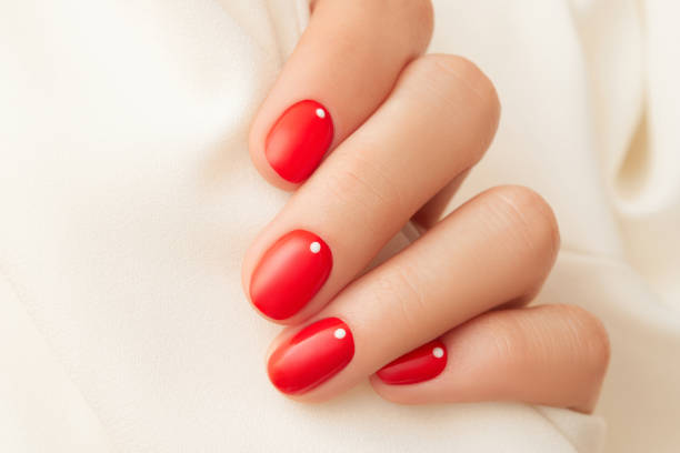 istock Close up womans hand with red manicure. Minimalist nail design 2167200857