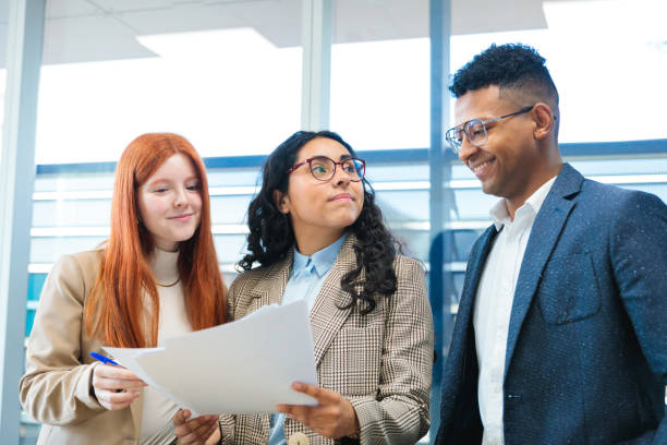 istock Young professionals collaborating on a project in a modern office 2167202466