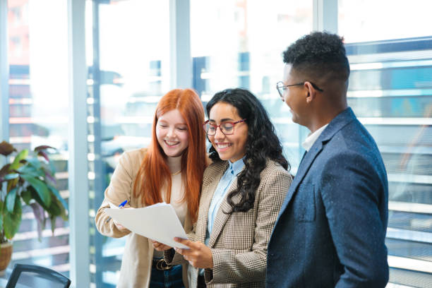Young professionals collaborating on a project in a modern office