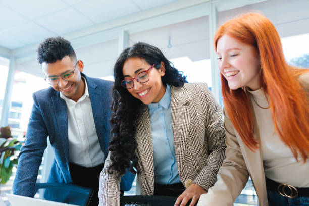istock Young adults immersed in a collaborative business project in a bright co-working space. 2167202519