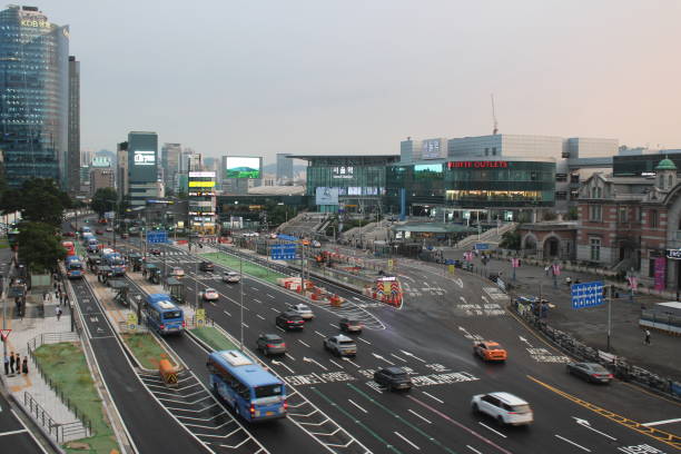 Seoul, South Korea-August 13, 2024: Evening view of modern Seoul Station complex with traffic passing by