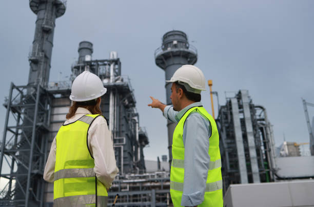 istock Blue-collar work  white people discussing their job progress at a thermal power plant in an industrial estate 2167204004
