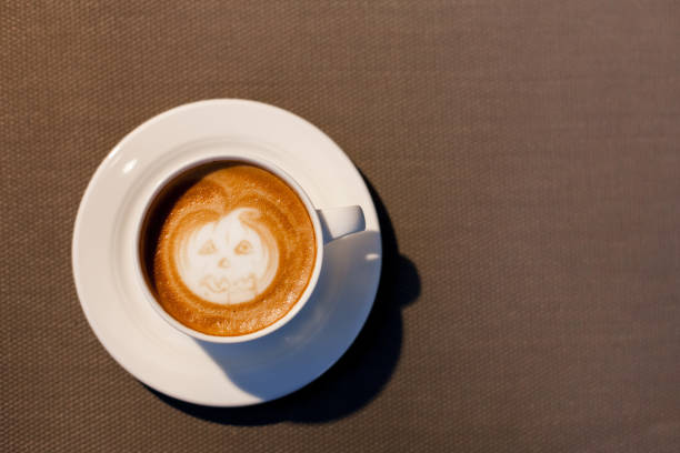 istock Halloween pumpkin coffee with painting. Flat lay with holiday drinks. Top view. 2167204072