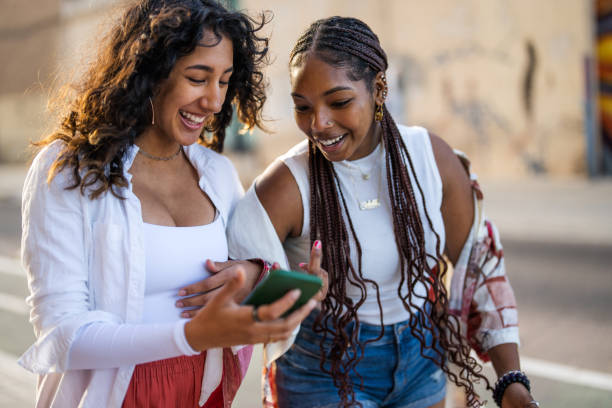 istock Diverse Friends Sharing Happiness with a Smartphone Outdoors 2167204205
