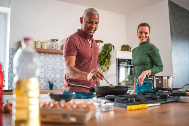 istock Mature Multi-Ethnic Couple Prepares Lunch with Love 2167205815