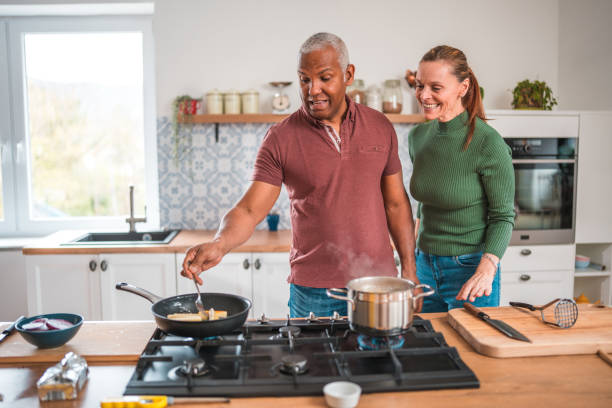 istock Mature Couple Having Fun While Cooking Together 2167205822