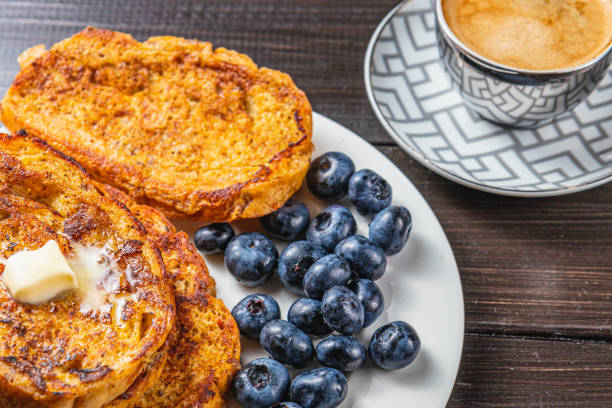 istock French toast on a white plate with blueberries and coffee for breakfast 2167212605