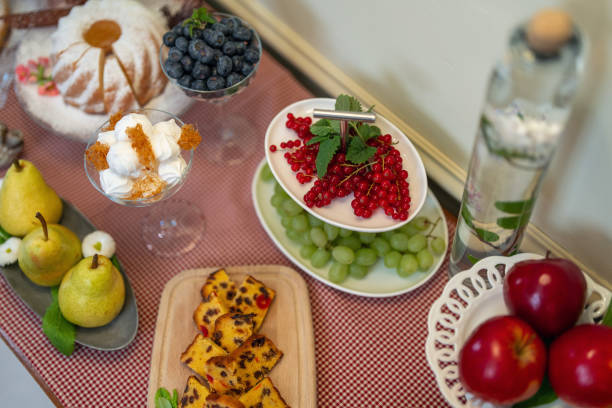 Elegant breakfast offerings on a self-service bar at a boutique hotel, featuring fresh fruit, pastries, and a diverse array of delectable choices laid out on a polka-dot tablecloth.