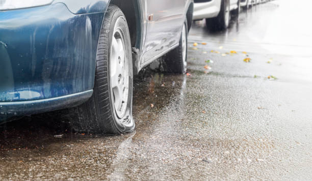 istock Flat Car Tire on a Rainy Day 2167217101