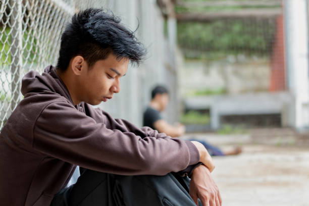 istock Asian boy in poor school detention center 2167219250