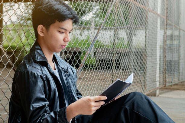 istock Asian boy in poor school detention center 2167219261