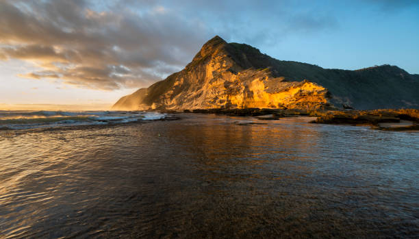 istock Gerickes Point Coastal Cliffs in sedgefield in the Garden Route magnificent weathered sandstone cliffs are the highest vegetated fossilised dunes in South Africa. 2167221008
