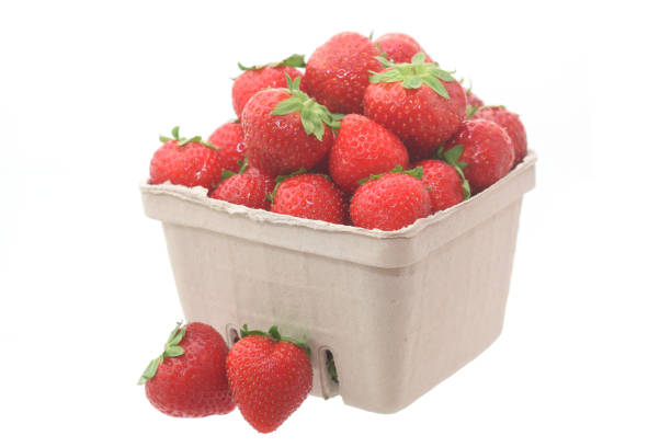 istock Organic strawberries in basket isolated on white 2167221173