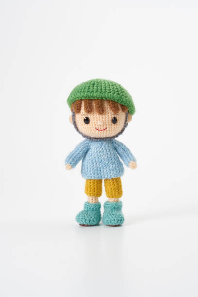 istock Small and cute Amigurumi doll on white background.Disaster prevention training 2167224478