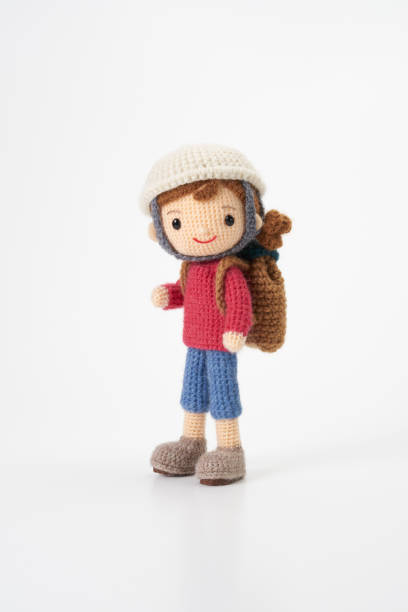 istock Small and cute Amigurumi doll on white background.Disaster prevention training 2167224528