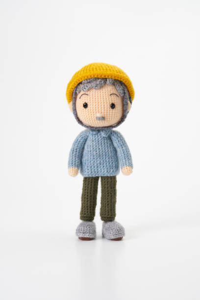 istock Small and cute Amigurumi doll on white background.Disaster prevention training 2167224587