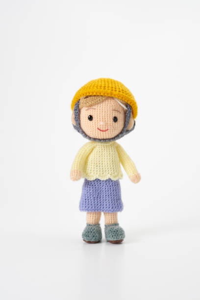 istock Small and cute Amigurumi doll on white background.Disaster prevention training 2167224621