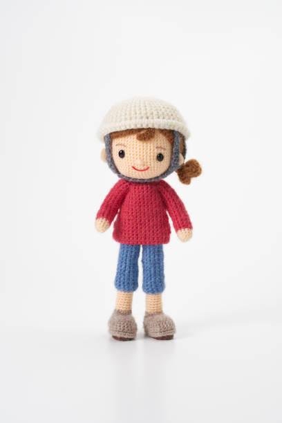istock Small and cute Amigurumi doll on white background.Disaster prevention training 2167224689