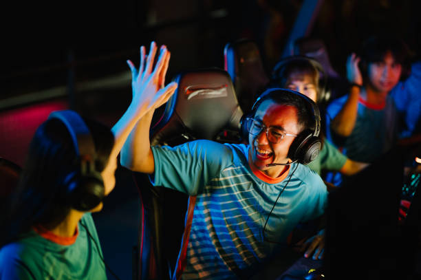istock Esport gamers win and high five. 2167225211