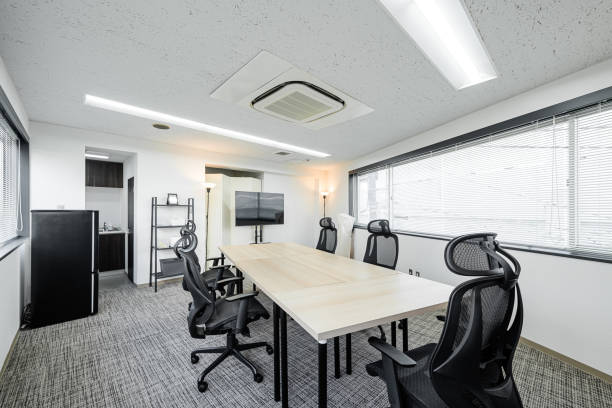 Rental space for wooden desks stock photo