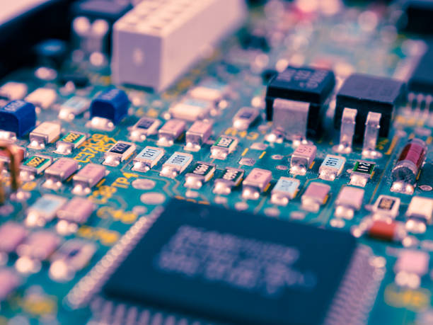istock Close-up of microcircuits and components: chips, diodes and capacitors on a printed circuit board, revealing the world of electronics 2167227293