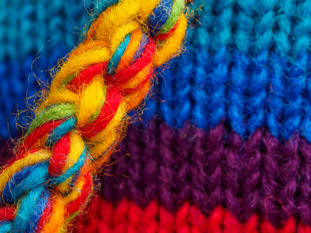 Multi colored balls of wool and needles in a basket, close-up view. Galicia, Spain.