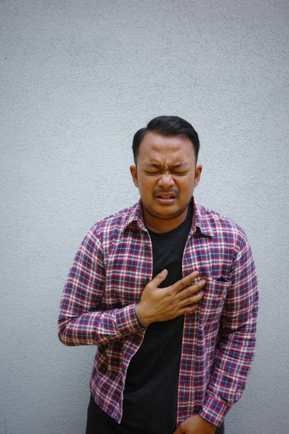 istock A man is posing as if having a heart attack 2167228123