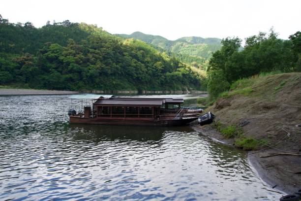 istock Yakatabune crossing the Shimanto River at anchor 2167229802