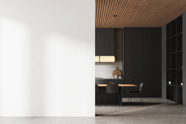 istock Dark kitchen interior with eating and cooking cabinet with shelves. Mockup wall 2167229849