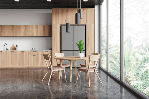 istock Home kitchen interior with eating table and cooking cabinet. Panoramic window 2167229884