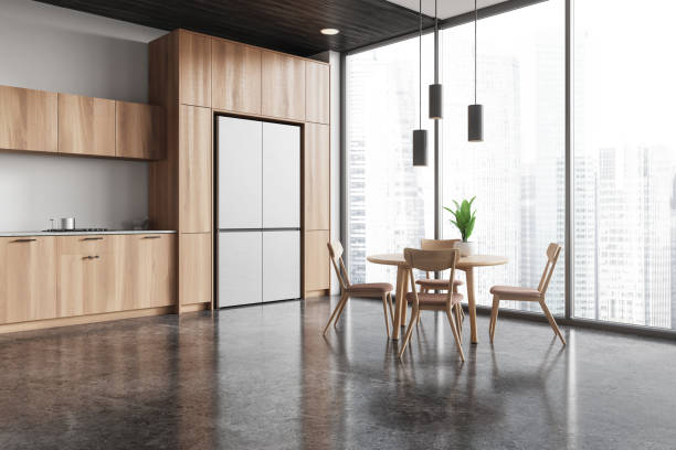 istock Modern home kitchen interior with cabinet and eating table, panoramic window 2167230036