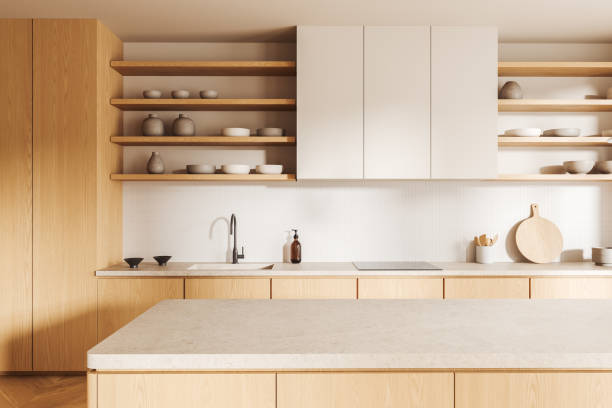 istock Light home kitchen interior with bar counter, sink and kitchenware with shelves 2167230071