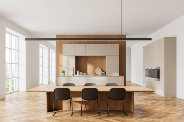 istock Cozy home kitchen interior with dining table andh chairs, cabinet and window 2167230942