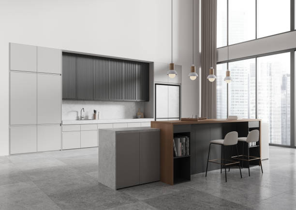 istock Stylish kitchen interior with eating and cooking space, kitchenware and window 2167231022