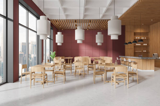 istock Modern cafe interior with dining tables and chairs in row, panoramic window 2167231198
