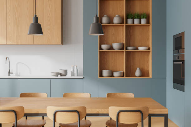 istock Luxury home kitchen interior with eating table, kitchenware and appliances 2167231389