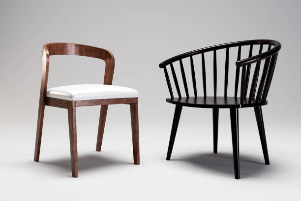 Chairs with black and wooden frames and gray cushions.